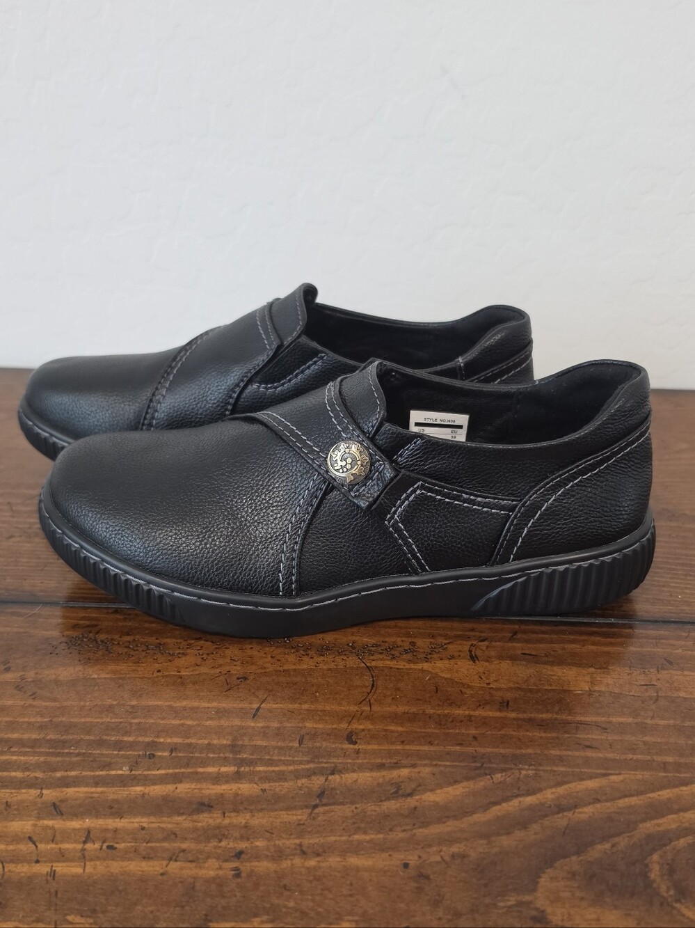 Clarks Black Slip-On Women's Loafers with Button Accent